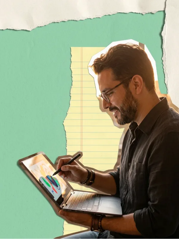 A man drawing with a pen on a touchscreen laptop, on a collage of mint and lined yellow paper