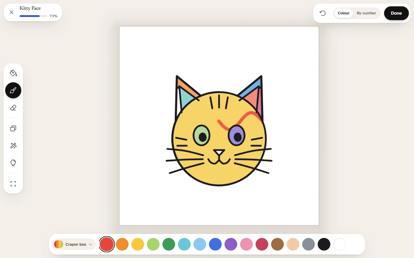 A cat face being coloured on a child’s profile, with big parts and a crayon palette